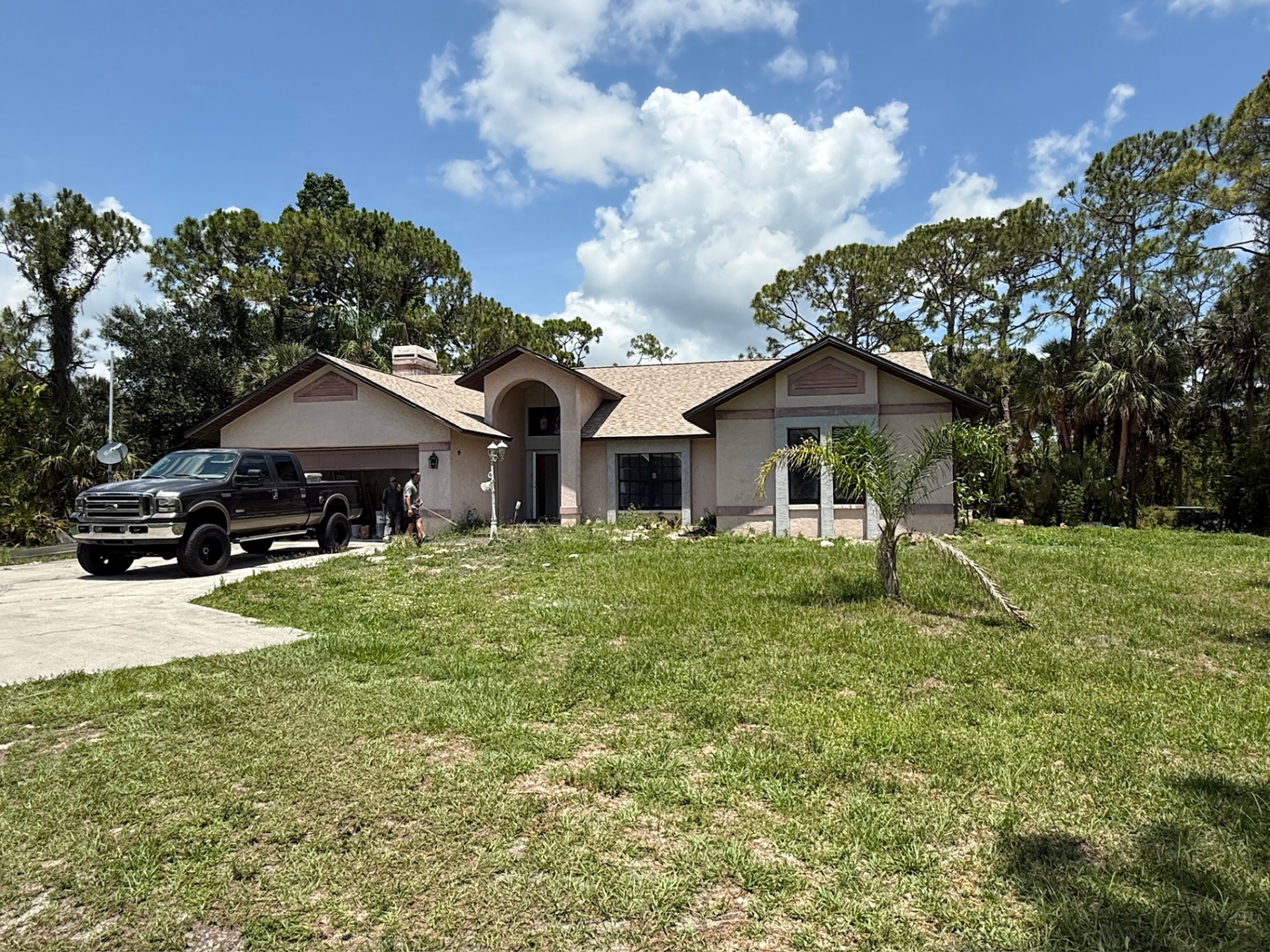 Lehigh Acres ranch home on a wooded lot — example of an inherited SWFL property bought as-is